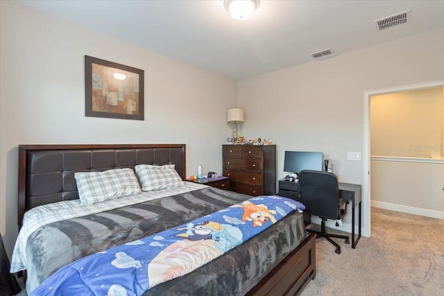 bedroom featuring light carpet