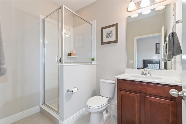 bathroom featuring tile patterned flooring, vanity, toilet, and a shower with shower door