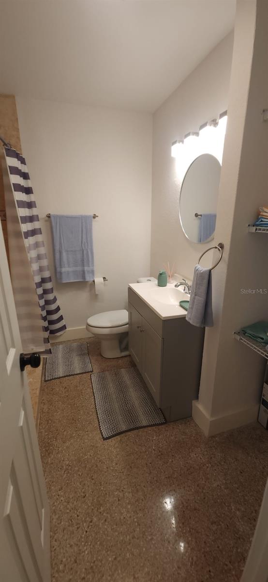 bathroom with vanity and toilet