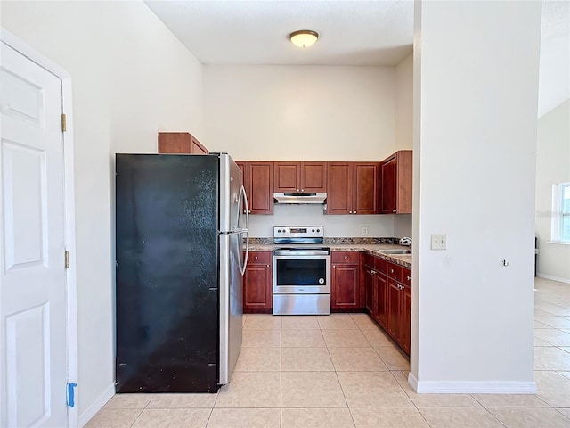 kitchen featuring stainless steel appliances, sink, and light tile patterned floors