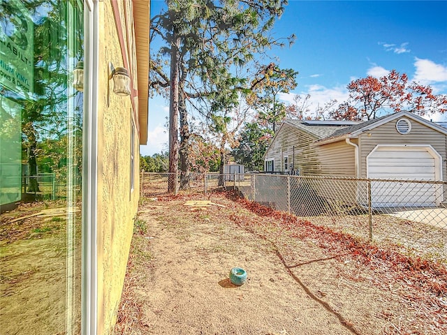 view of yard featuring a garage