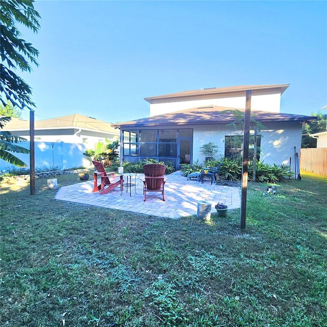 view of yard featuring a patio area and a sunroom