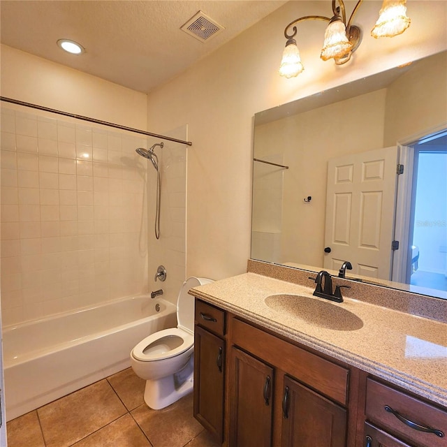 full bathroom with tile patterned floors, vanity, bathtub / shower combination, and toilet