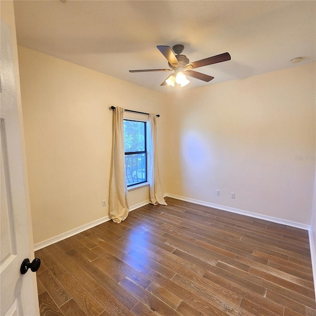 unfurnished room featuring ceiling fan and dark hardwood / wood-style flooring