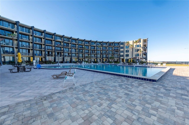 view of swimming pool featuring a patio