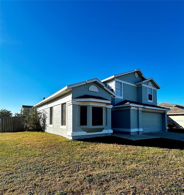 exterior space featuring a front yard and a garage