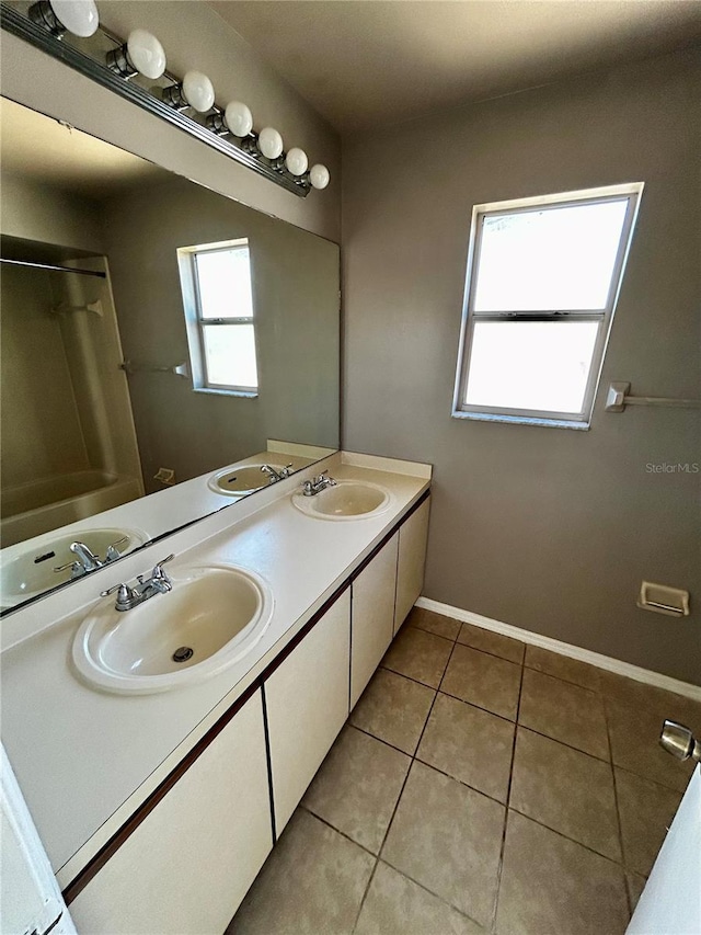 bathroom with tile patterned flooring and vanity