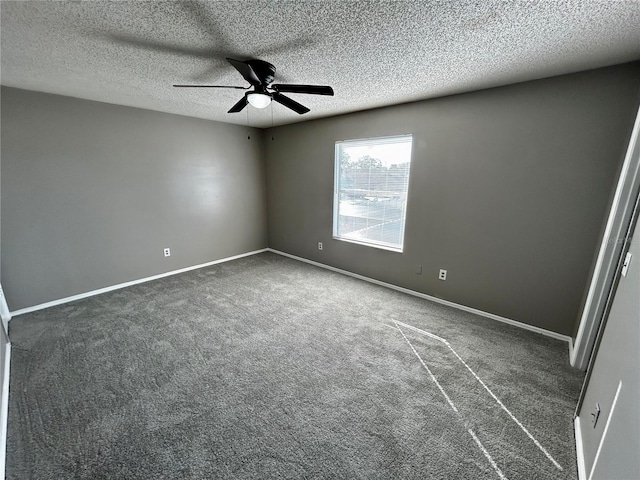 carpeted empty room featuring ceiling fan and a textured ceiling