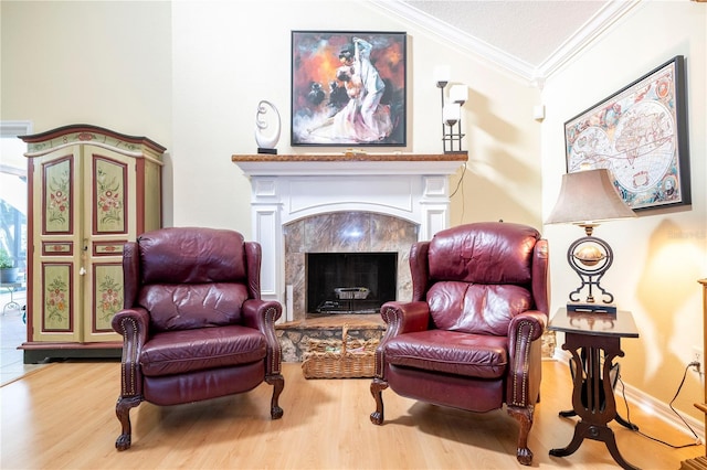 sitting room featuring hardwood / wood-style floors and ornamental molding