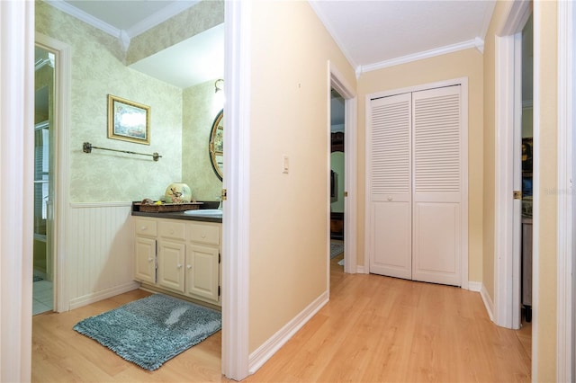 bathroom with vanity, ornamental molding, and hardwood / wood-style flooring