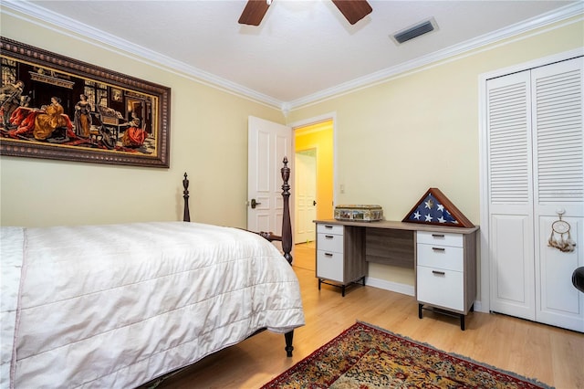 bedroom featuring ceiling fan, a closet, light hardwood / wood-style floors, and ornamental molding