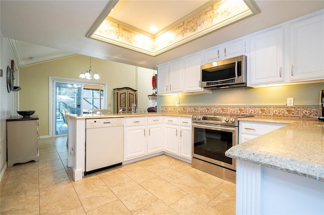 kitchen featuring white cabinets, kitchen peninsula, stainless steel appliances, and a chandelier