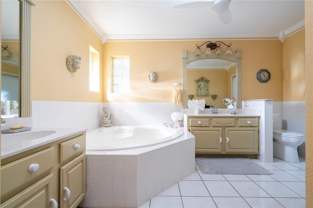 bathroom with toilet, ornamental molding, and tiled tub