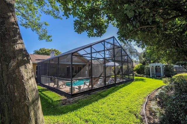 exterior space with a yard and a lanai