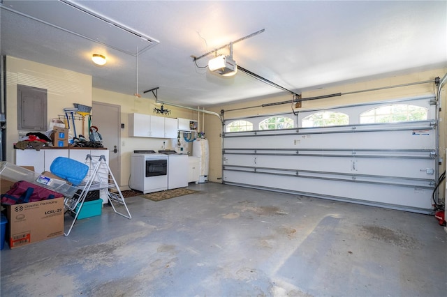 garage with electric panel, washer and dryer, and a garage door opener