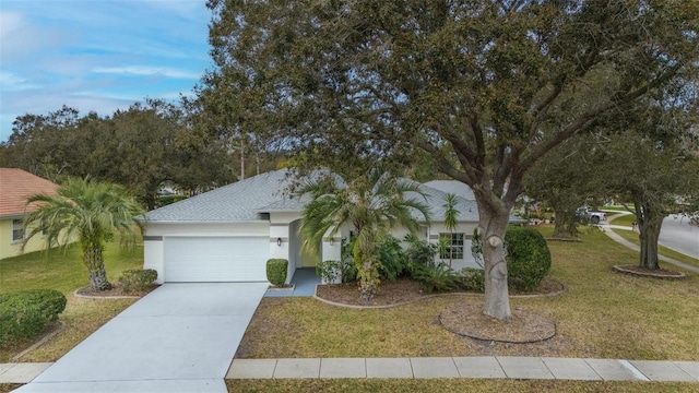 view of front of property with a garage and a front yard