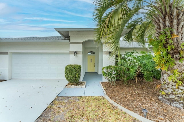 view of exterior entry featuring a garage