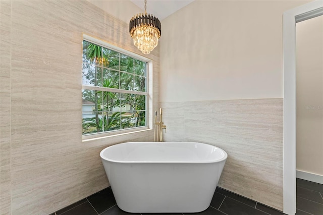 bathroom featuring tile patterned flooring, tile walls, and a healthy amount of sunlight