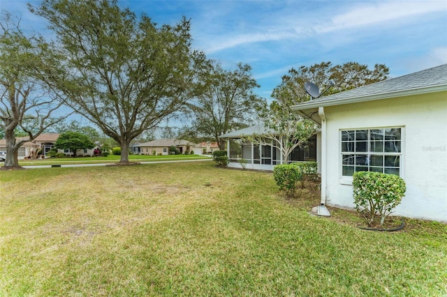 view of yard featuring a sunroom