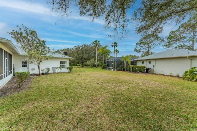 view of yard with a lanai