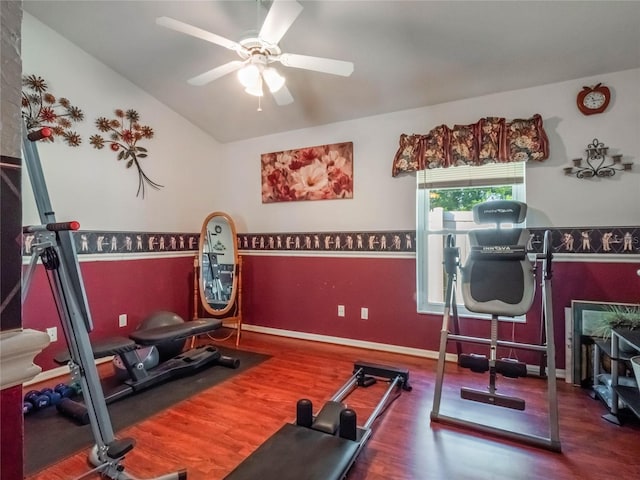 exercise room featuring hardwood / wood-style floors, ceiling fan, and vaulted ceiling