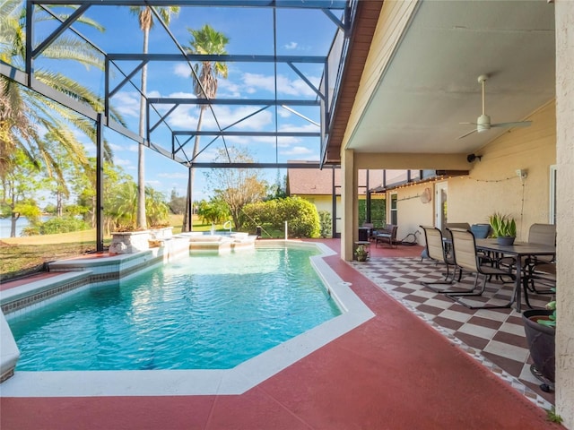 view of pool featuring an in ground hot tub, a patio area, ceiling fan, and a lanai