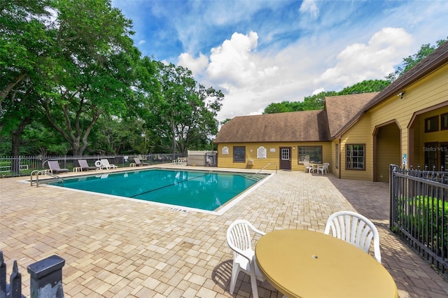 view of swimming pool with a patio area