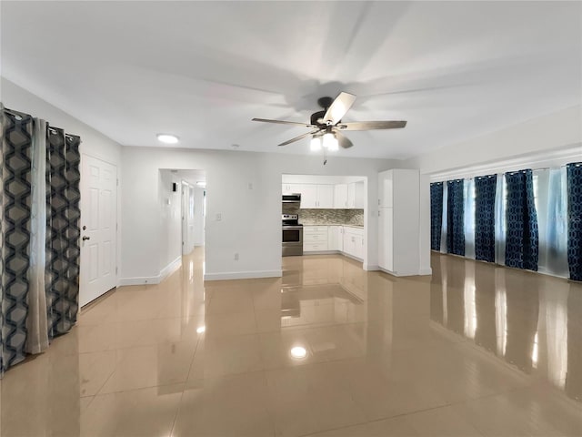 unfurnished living room with ceiling fan and light tile patterned floors