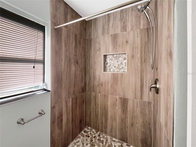 bathroom with tiled shower