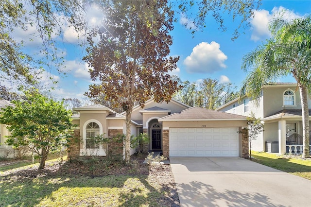 view of front of property featuring a garage and a front lawn