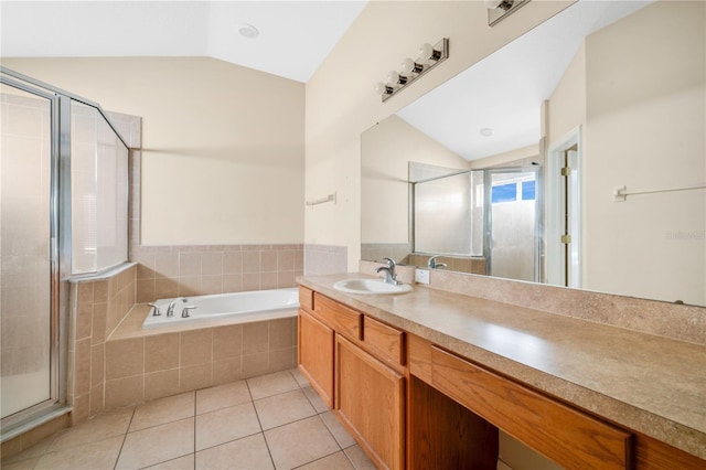 bathroom with tile patterned floors, vanity, shower with separate bathtub, and vaulted ceiling