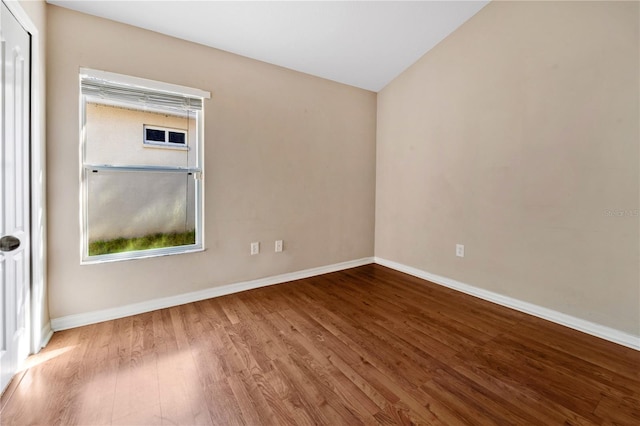 spare room featuring hardwood / wood-style flooring