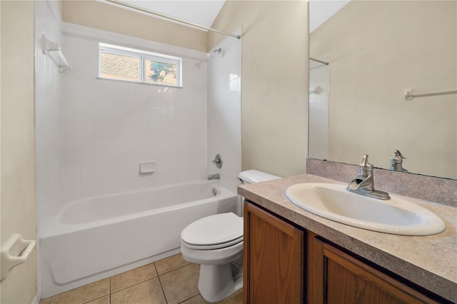 full bathroom with tile patterned flooring, vanity, tiled shower / bath combo, and toilet