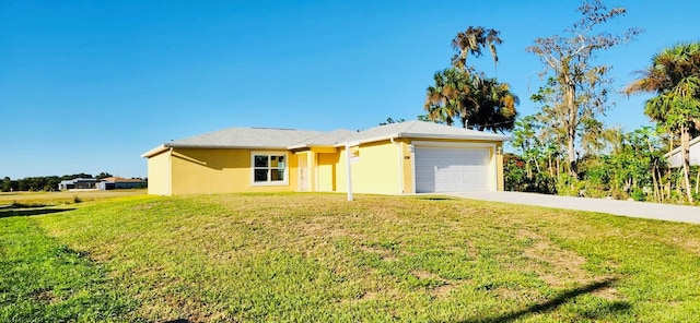 single story home featuring a garage and a front yard