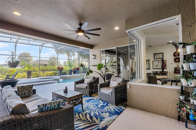 sunroom / solarium with a swimming pool and ceiling fan