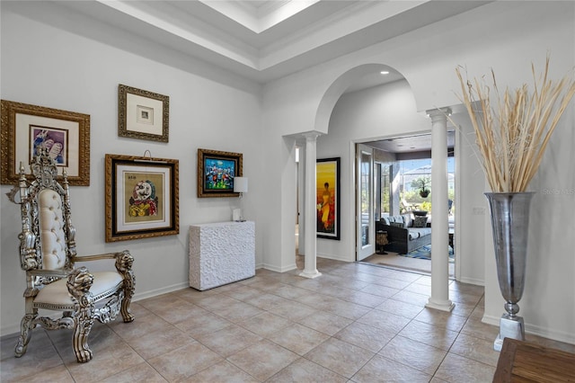 tiled foyer entrance featuring ornamental molding