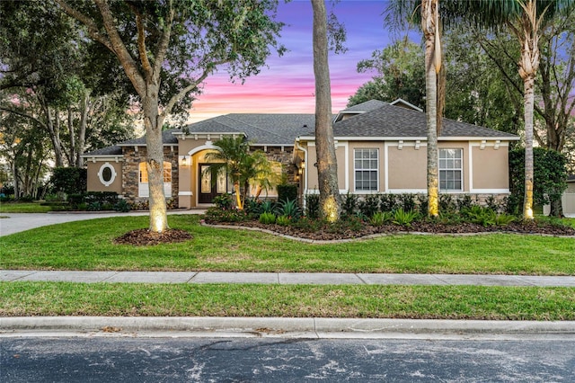 view of front of home featuring a lawn