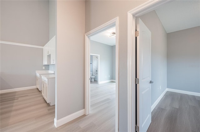 hallway with light wood-type flooring