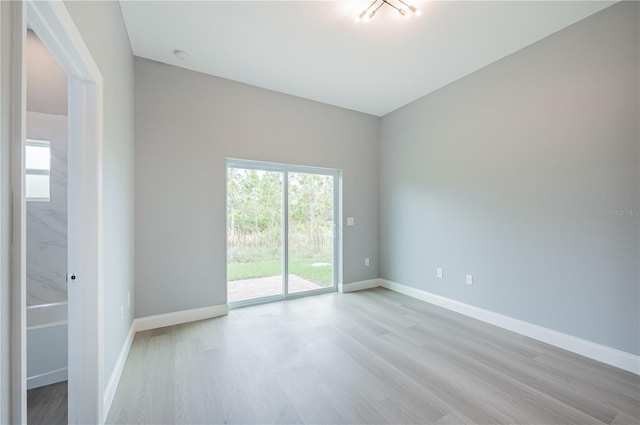 empty room with light hardwood / wood-style floors