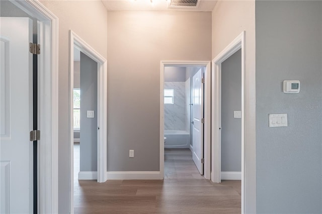 hallway featuring light hardwood / wood-style flooring