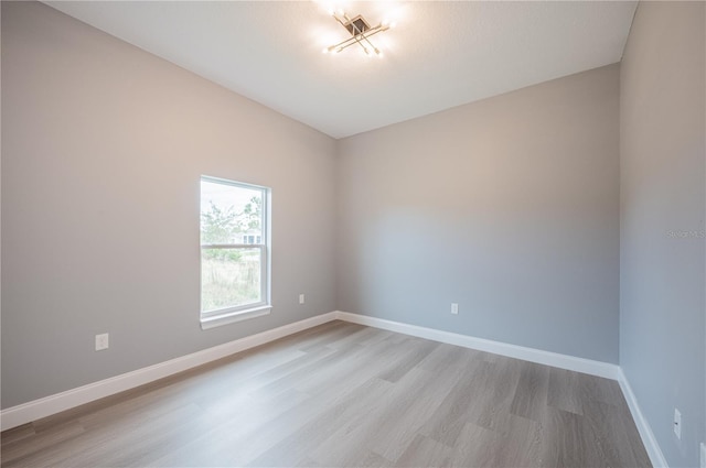 empty room with light hardwood / wood-style floors