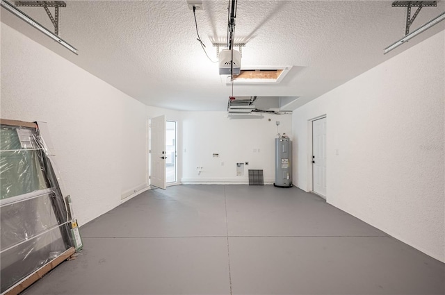 garage featuring electric water heater and a garage door opener