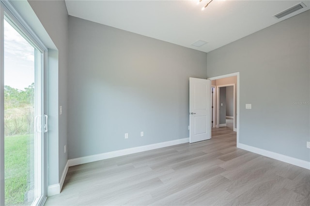 unfurnished room featuring light wood-type flooring