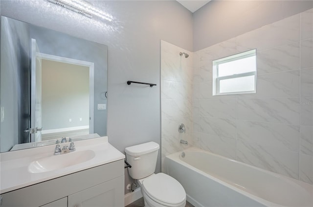 full bathroom with vanity, toilet, and tiled shower / bath