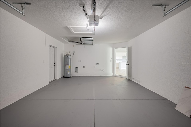 garage featuring electric water heater and a garage door opener