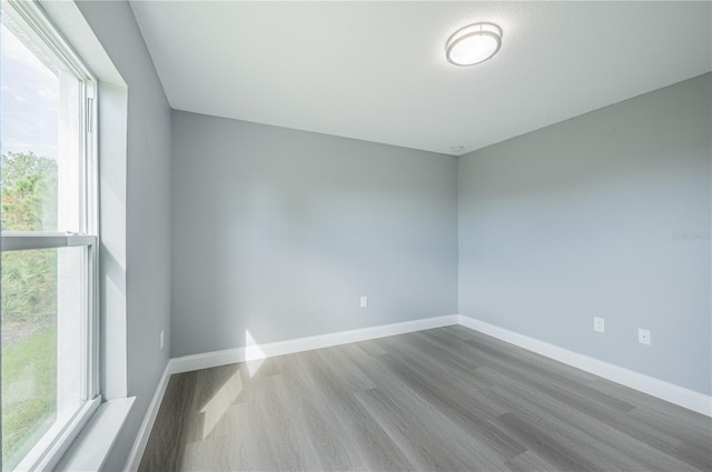 spare room featuring light wood-type flooring