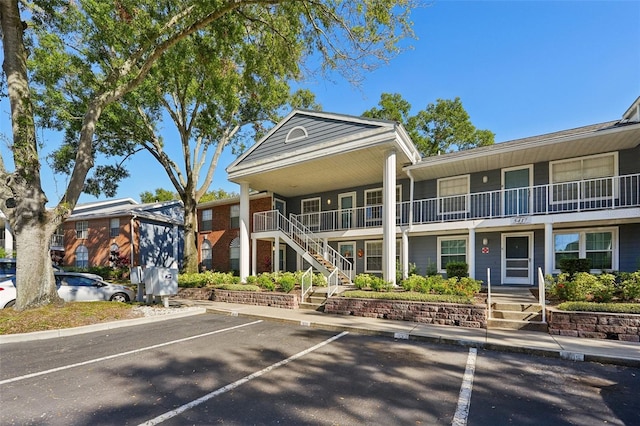 5417 Lake Margaret Dr Unit G, Orlando, FL 32812 - view of property featuring uncovered parking and stairs