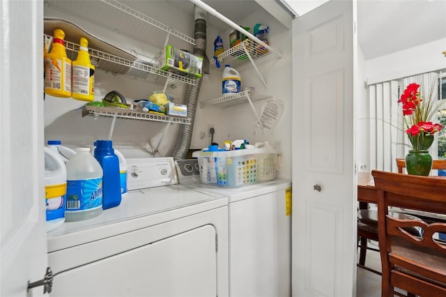 laundry area featuring washing machine and clothes dryer