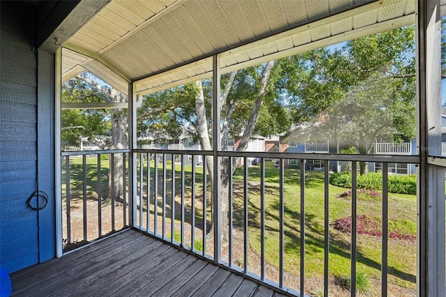 unfurnished sunroom with vaulted ceiling