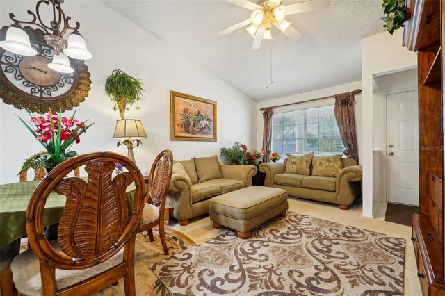 5417 Lake Margaret Dr Unit G, Orlando, FL 32812 - living area featuring vaulted ceiling, ceiling fan, and a textured ceiling
